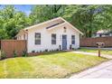 Inviting single-story home featuring a well-maintained lawn and classic curb appeal at 2294 Hill Nw St, Atlanta, GA 30318