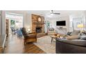 Cozy living room featuring a brick fireplace, hardwood floors, and an open floor plan at 755 Monticello Se Way, Marietta, GA 30067