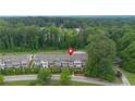 Aerial view of well-maintained townhomes with lush greenery and neighborhood streets at 2022 Talmai Dr, Snellville, GA 30078