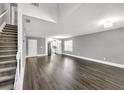 Bright, spacious living room with wood floors and lots of natural light is perfect for relaxation at 577 Cypher Drive, Suwanee, GA 30024