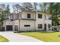 Beautiful new home with a large driveway, attached garage, and manicured landscaping at 3293 Lenox Ne Pl, Atlanta, GA 30324