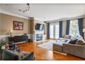 Inviting living room featuring hardwood floors, fireplace, and modern decor at 1040 Emory Parc Pl, Decatur, GA 30033