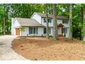 Lovely two-story home with a brick exterior, attached garage, and a professionally landscaped front yard at 280 E Valley Dr, Marietta, GA 30068