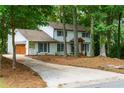 Beautiful two-story home featuring brick accents, a garage, and a well-maintained lawn for enhanced curb appeal at 280 E Valley Dr, Marietta, GA 30068