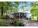 Home featuring a screened-in back porch with lattice detailing, a cozy area for outdoor enjoyment at 6480 Port A Prince Drive Dr, Forest Park, GA 30297