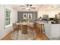 Eat-in kitchen and dining area features a ceiling fan and updated countertops at 1445 Monroe Ne Dr # F10, Atlanta, GA 30324