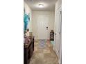 Inviting entryway with neutral tones, stylish decor, and convenient coat closet at 2080 Belmont Cir, Conyers, GA 30012