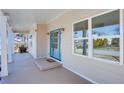 Inviting porch with a bright blue door and views of the surrounding neighborhood at 3286 Bachelor Street, East Point, GA 30344