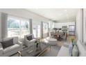 Open-concept living area featuring a modern kitchen, dining space, and cozy seating at 3286 Bachelor Street, East Point, GA 30344