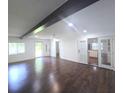 Bright living area with hardwood floors, natural light and access to the kitchen at 2821 Ne Meadowlark Trail, Duluth, GA 30096