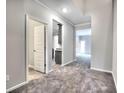Open-concept foyer showcasing plush gray carpets and clean lines, offering seamless transitions to the rest of the home at 335 Melody Ne Ln, Cartersville, GA 30121
