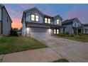 Charming home featuring a well-kept lawn, and inviting porch with an attached two-car garage at 4720 Dufour Dr, Lilburn, GA 30047