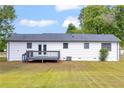 View of the house from the backyard showing the deck and nice lawn at 2657 John Petree Rd, Powder Springs, GA 30127