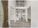 Welcoming foyer with wood-look floors, a staircase, and soaring ceilings at 3385 Amhurst Pkwy, Atlanta, GA 30349