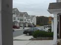 Street view of a group of townhomes with similar architectural features, like shuttered windows at 6895 Slate Stone Se Way # 3, Mableton, GA 30126