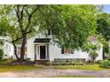 Beautiful one-story home boasting a landscaped front yard and mature tree canopy, creating a welcoming entrance at 1981 N Decatur Ne Rd, Atlanta, GA 30307