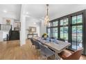 Dining room with modern lighting, dark window trim, and large windows providing natural light at 2756 Octavia Ln, Marietta, GA 30062