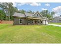 Charming single-story home with large front lawn and a covered porch with symmetrical posts at 96 Lexie Ct, Rockmart, GA 30153