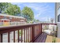 Balcony featuring wood flooring, a chair and table with an outdoor view of the surrounding area at 277 Ralph David Abernathy Sw Blvd, Atlanta, GA 30312