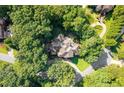 An aerial shot of a home surrounded by trees at 4670 Hamden Forest Sw Dr, Atlanta, GA 30331