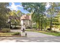 Beautifully landscaped home with a circular driveway at 4670 Hamden Forest Sw Dr, Atlanta, GA 30331