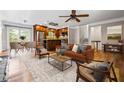 Open-concept living room and kitchen with hardwood floors and stainless steel appliances at 5610 N Allen Rd, Mableton, GA 30126