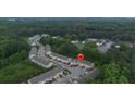 Aerial view of the townhome community with lush green surroundings at 3155 Tarian Way, Decatur, GA 30034