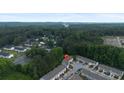 Aerial view of the townhome community surrounded by lush greenery at 3155 Tarian Way, Decatur, GA 30034