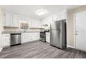 Modern kitchen with stainless steel appliances, white cabinets, and stylish countertops at 3521 Brookhill Cir, Marietta, GA 30062