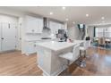 Modern kitchen featuring white cabinets, a central island, and stainless steel appliances at 2456 Hidden Creek Rd, Kennesaw, GA 30152