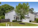 Beautiful home with well-maintained lawn, an attached garage and mature trees at 197 Cherokee Reserve Cir, Canton, GA 30115