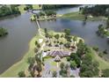 Aerial view of a beautiful golf course community on a lake with a bridge at 216 Villa Rica Spgs, Villa Rica, GA 30180