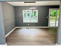 Dining room with a sliding door to a deck and a modern light fixture at 2615 Fox Hall South Ln, Atlanta, GA 30349