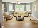 Stylized living room with hardwood floors, grey walls and lots of light at 2615 Fox Hall South Ln, Atlanta, GA 30349