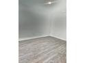 A bedroom with hard wood floors, white walls, and neutral trim at 195 Silvercrest Dr, Acworth, GA 30101