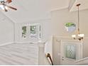 Bright entryway featuring new floors, a decorative chandelier, and an octagon window at 946 Redan Trce, Stone Mountain, GA 30088