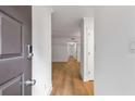 Bright entryway features sleek hardwood flooring and neutral, freshly painted walls at 1603 Cumberland Ct, Smyrna, GA 30080