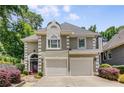 Attractive two-story home featuring a well-manicured lawn and a two-car garage at 1078 Shady Valley Ne Pl, Atlanta, GA 30324