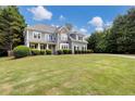 Beautifully landscaped lawn highlighting the exterior of this home and front yard at 1501 Laurelhill Drive Southwest Dr, Lawrenceville, GA 30044