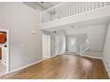 Open-concept living area with sleek flooring, abundant natural light, and a staircase to the second level at 484 Culberson Sw St, Atlanta, GA 30310