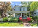 Beautiful two-story home with a welcoming front porch, classic architectural details, and mature landscaping at 513 Saint Charles Ne Ave, Atlanta, GA 30308