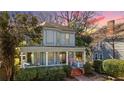 Charming two-story home boasting a spacious front porch and inviting curb appeal at 513 Saint Charles Ne Ave, Atlanta, GA 30308