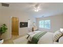 Serene main bedroom boasts a vaulted ceiling, walk-in closet, and natural light from the large windows at 768 Nehemiah Sw Ln, Atlanta, GA 30331