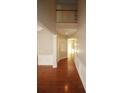 Welcoming foyer with gleaming hardwood floors and an open staircase at 942 Idlewood Dr, Canton, GA 30115