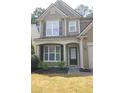 Inviting home exterior featuring manicured landscaping and a covered front porch at 942 Idlewood Dr, Canton, GA 30115