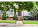 Inviting two-story home with manicured lawn, lush landscaping and a welcoming front entrance at 3937 Covey Flush Sw Ct # 25, Smyrna, GA 30082