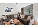 Comfortable living room with two sofas, stylish pillows, and a decorative cow painting at 406 Country Park Se Dr, Smyrna, GA 30080