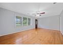 Bright, open living room with hardwood floors and a large window allowing natural light at 3047 Hudson Ct, Decatur, GA 30033