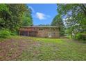 Expansive backyard with a wooden deck, ideal for outdoor entertaining and relaxation at 3510 Dunn Se St, Smyrna, GA 30080
