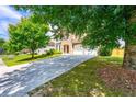 Attractive two-story home featuring a spacious driveway and a well-maintained front lawn at 3524 Preserve Run Trl, Loganville, GA 30052